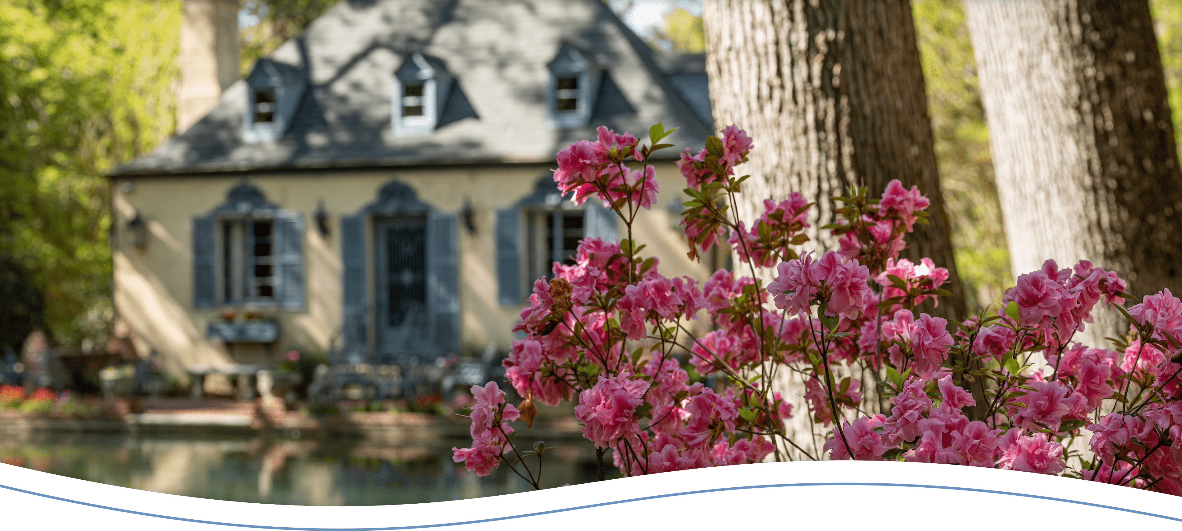 Flowers in front of a mansion