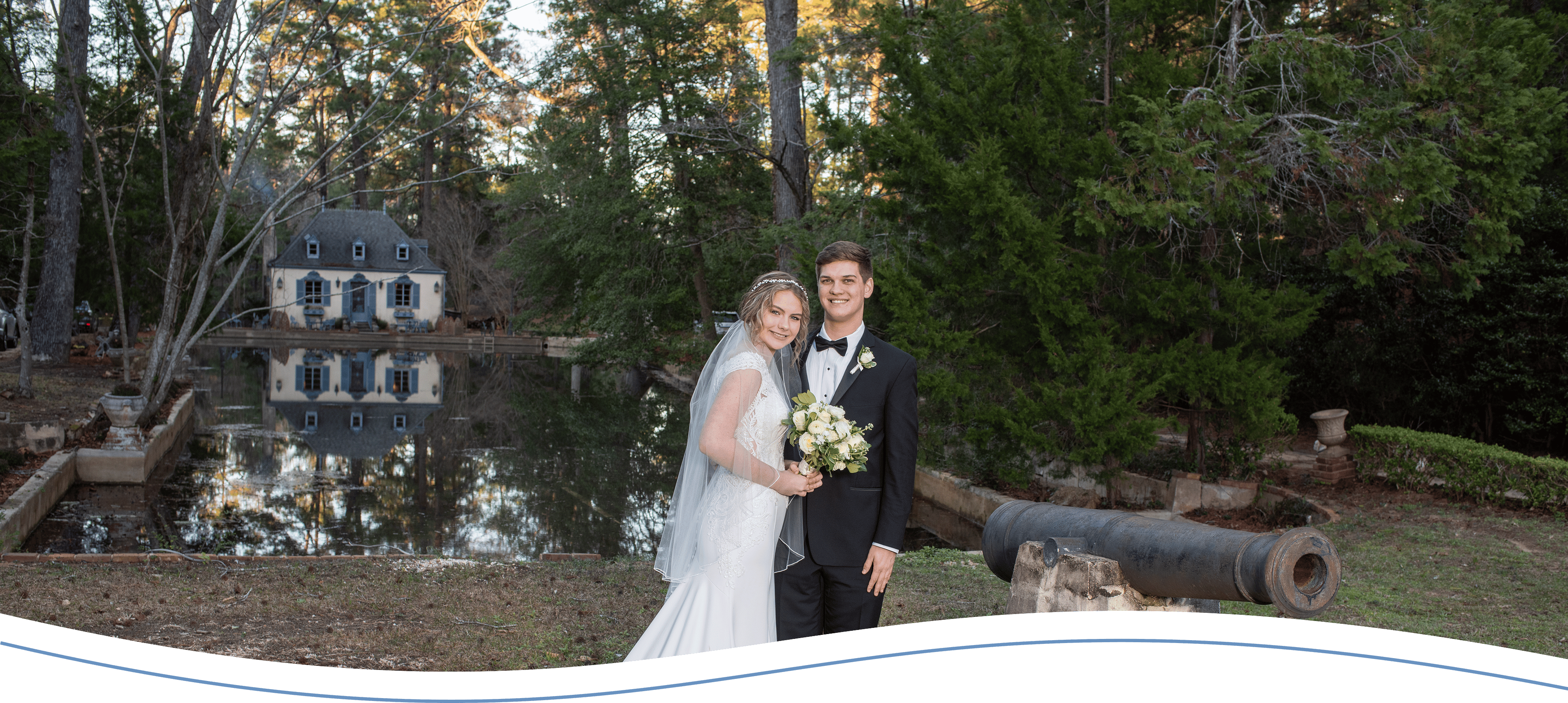 A bride and groom pose for the camera.